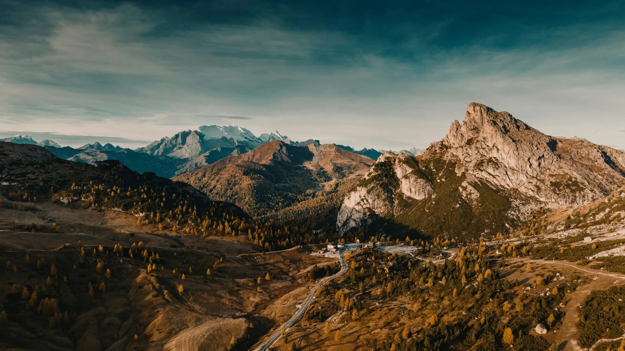 Trekker overlooking the Himalayas at sunrise